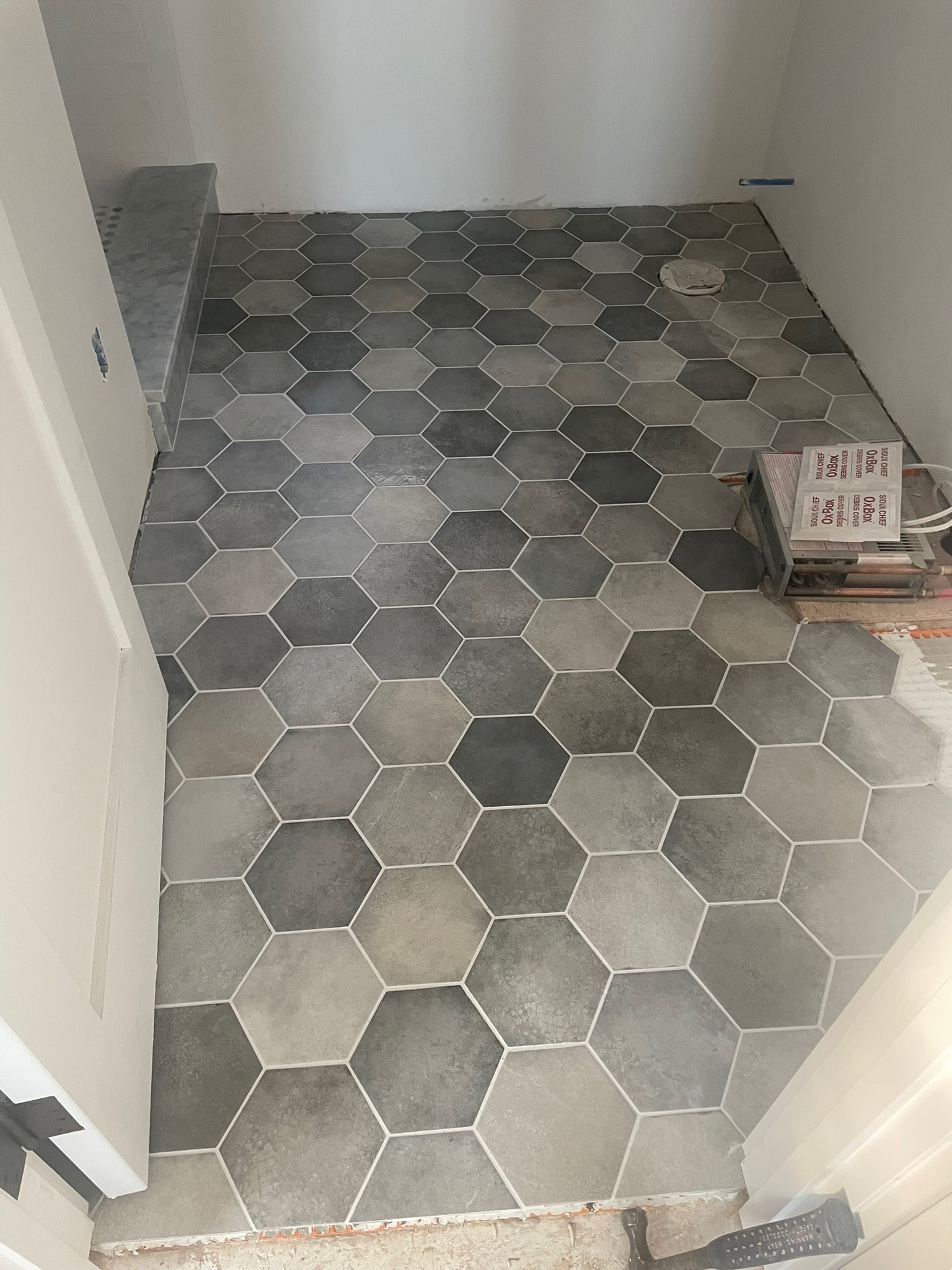 Large hexagon floor tile installation
