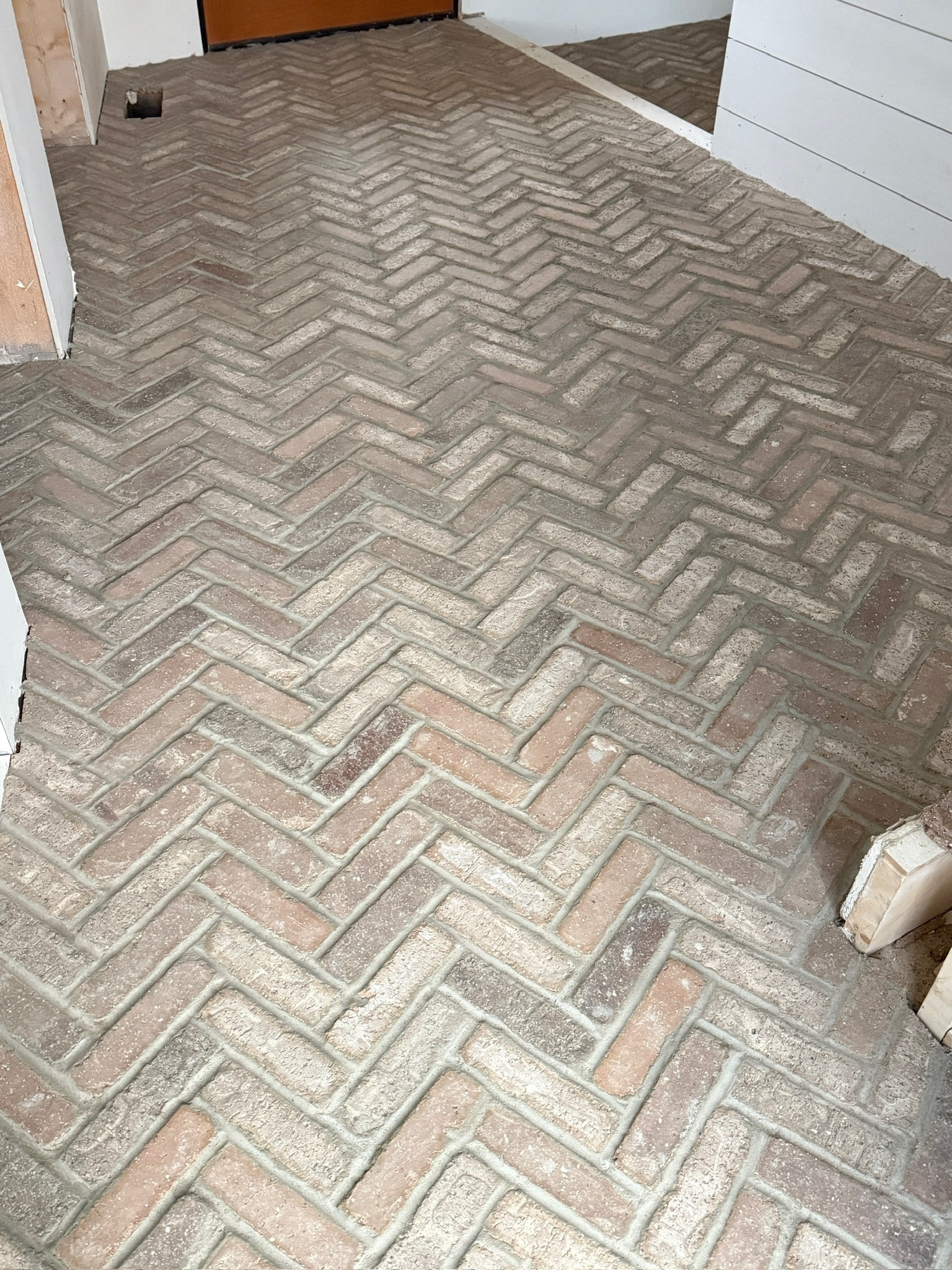 Herringbone brick-look floor tile